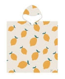 Poncho de plage enfant anti sable beige avec des motifs citrons jaunes